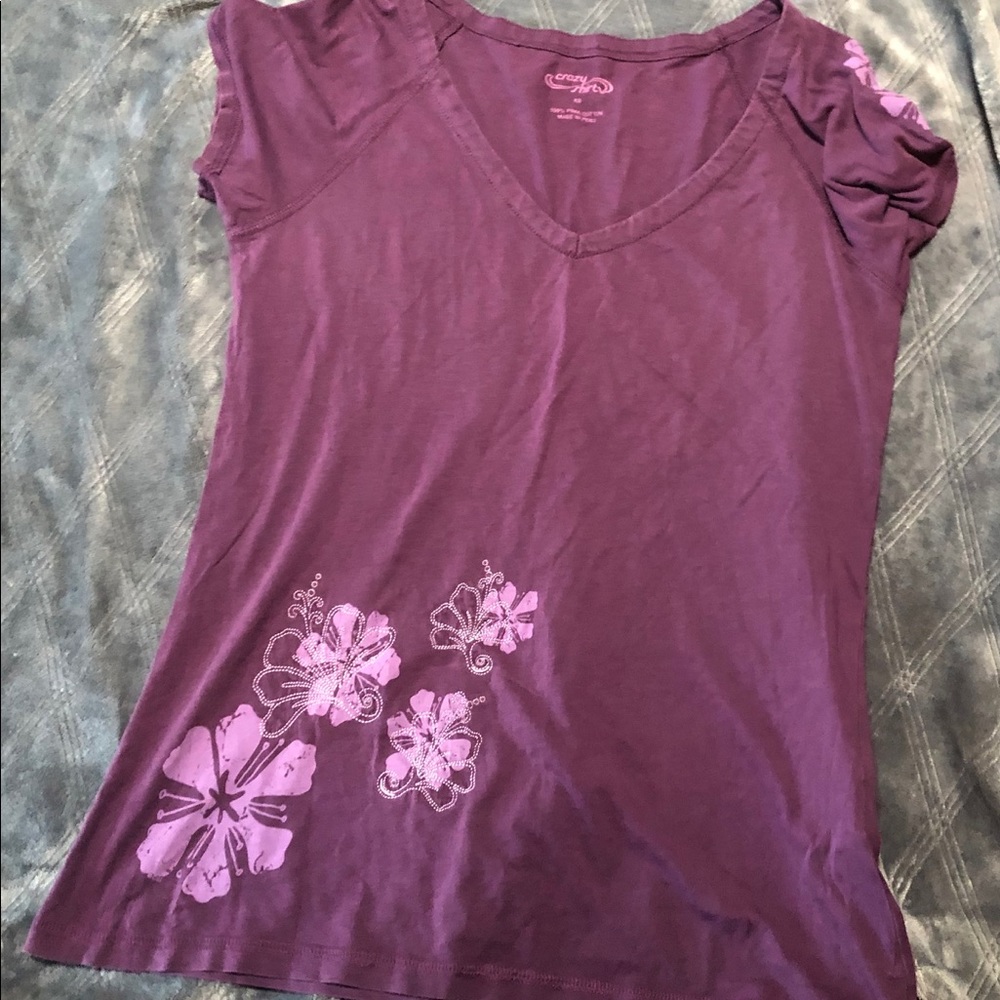 purple t-shirt with a floral design